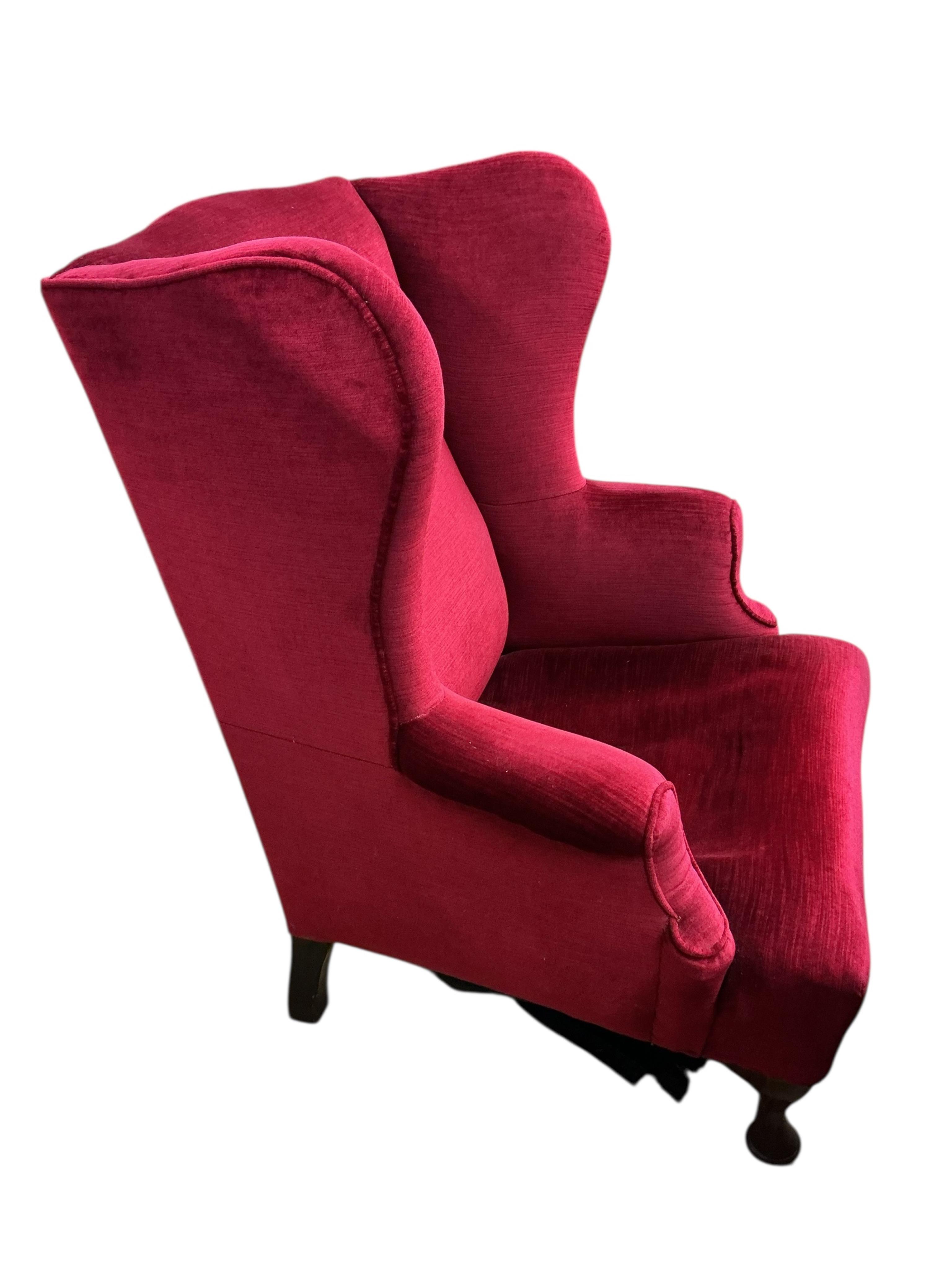 An early 20th century Queen Anne style upholstered wing armchair, width 83cm, depth 86cm, height 90cm